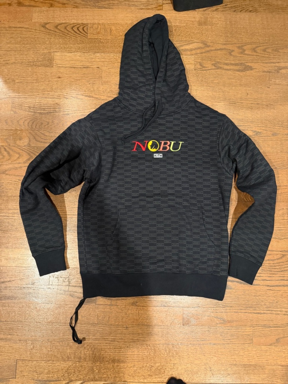 Kith Black 'NOBU' Logo Pattern Hoodie with Red and Yellow Accents